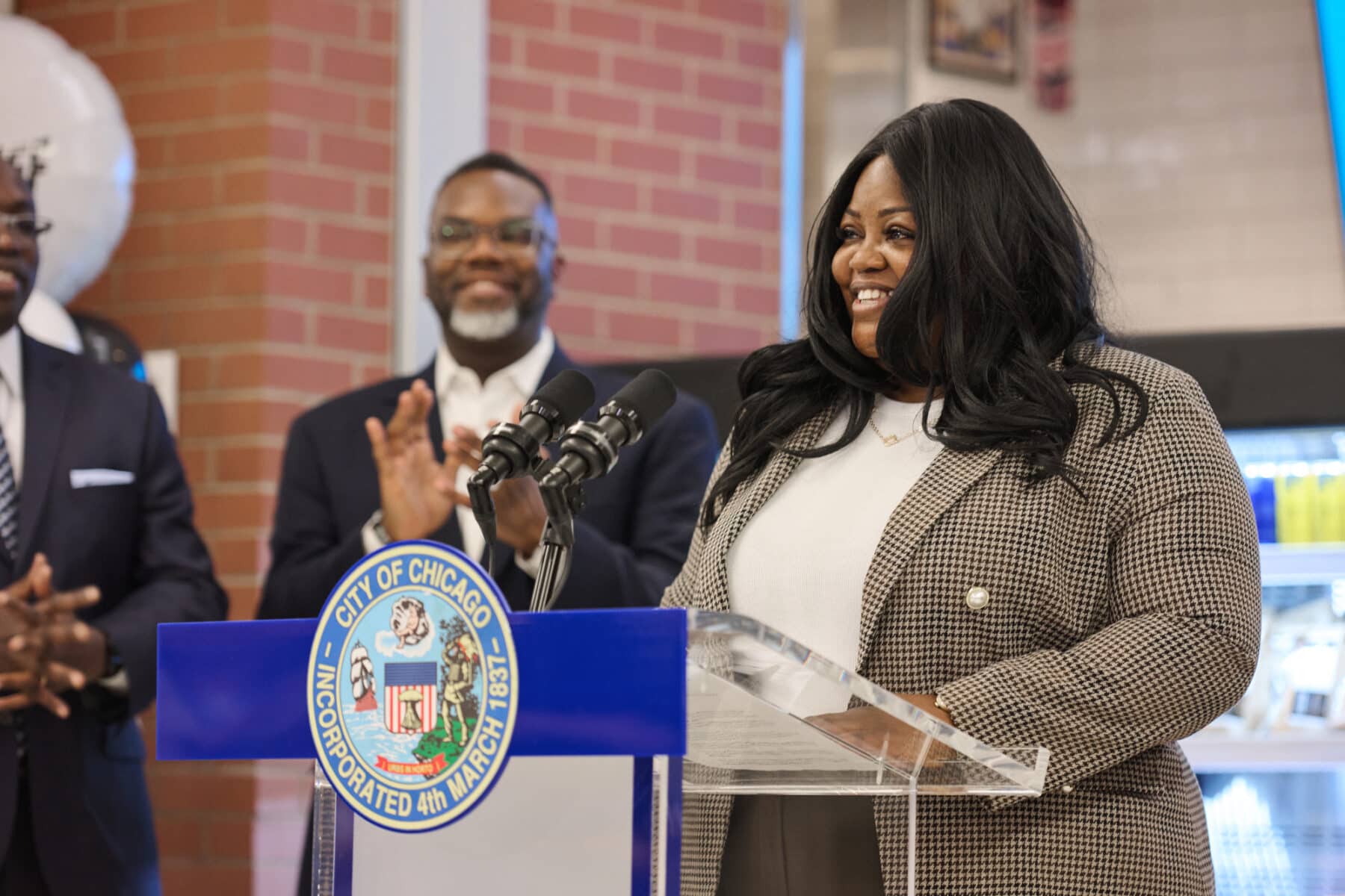 Shawnta Young speaking at podium in Chicago