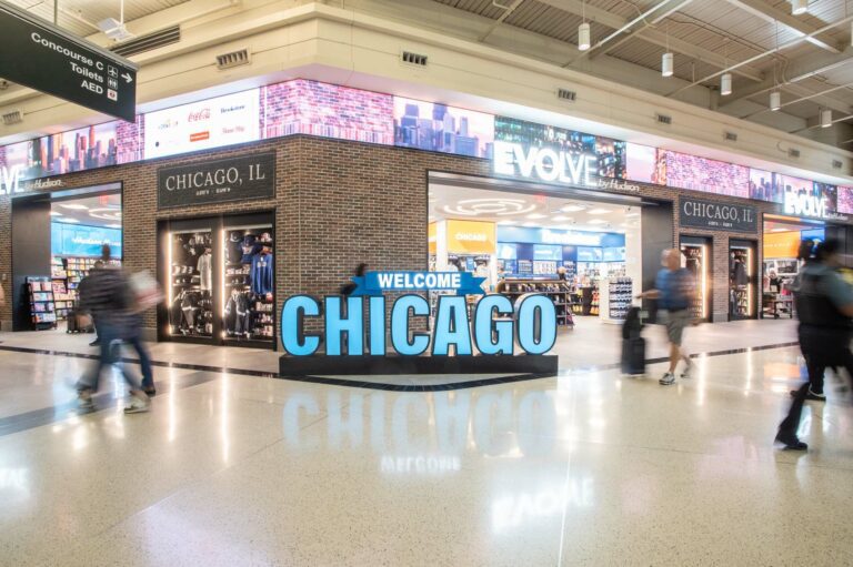 The Evolve storefront in an airport terminal sits behind a sign that reads "Welcome Chicago."