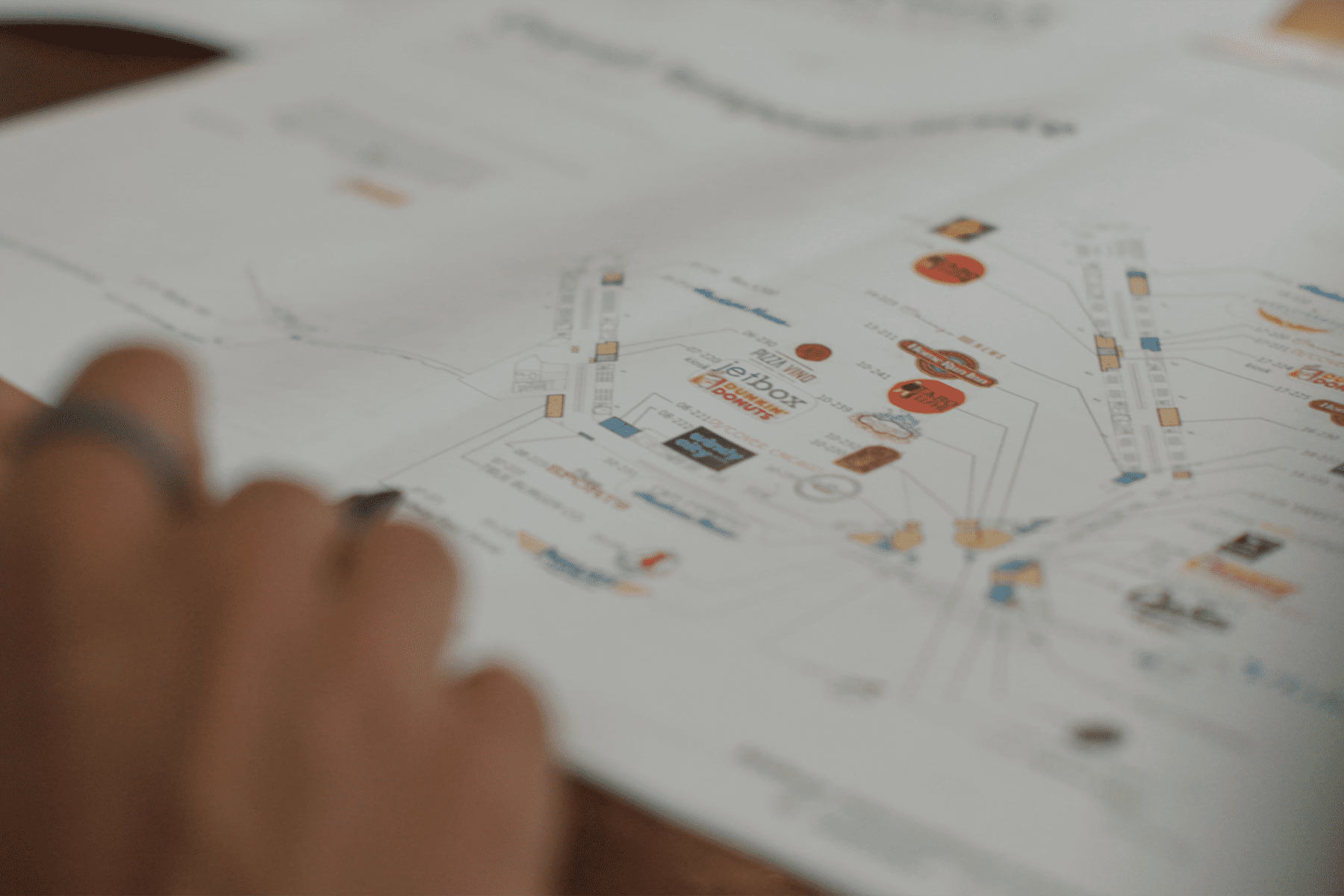 A close up of a business blue print for a new terminal development project.