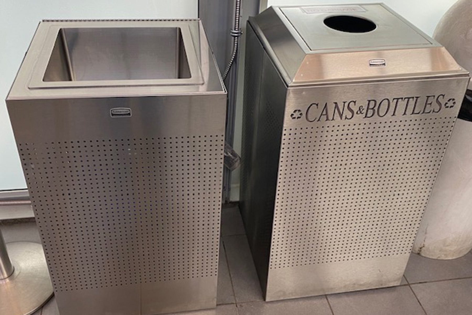 liquid disposal system on left and cans and bottles disposal bin on right