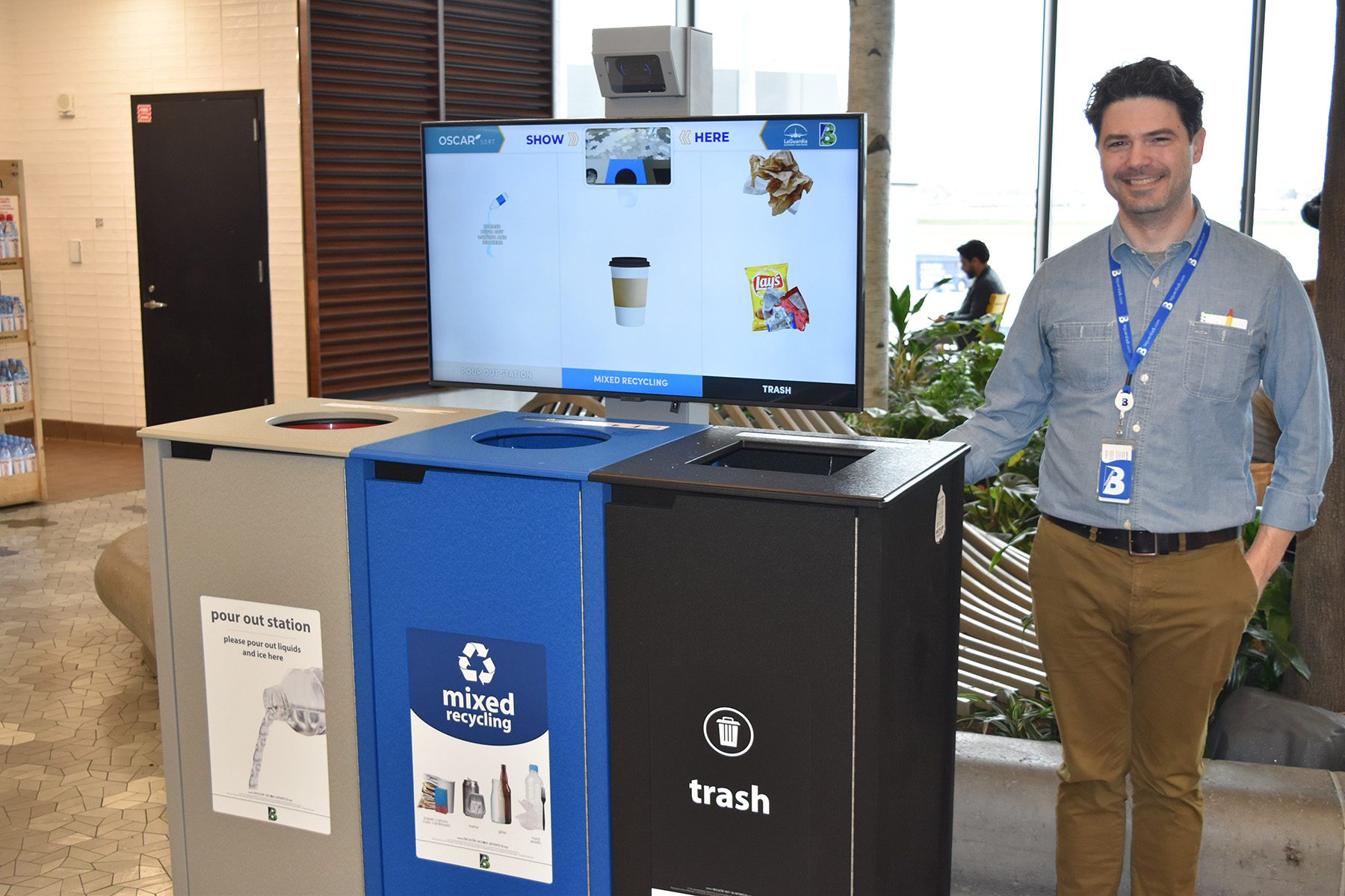 Justin Bland standing with Oscar - AI powered garbage system