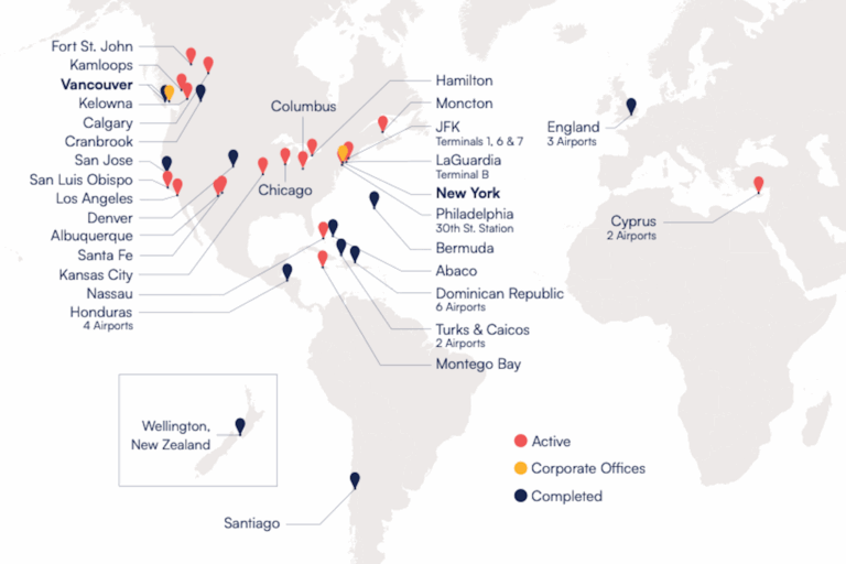 World map showing locations with pins on cities. Red pins indicate active sites; yellow pins show corporate offices; and blue pins show completed sites.