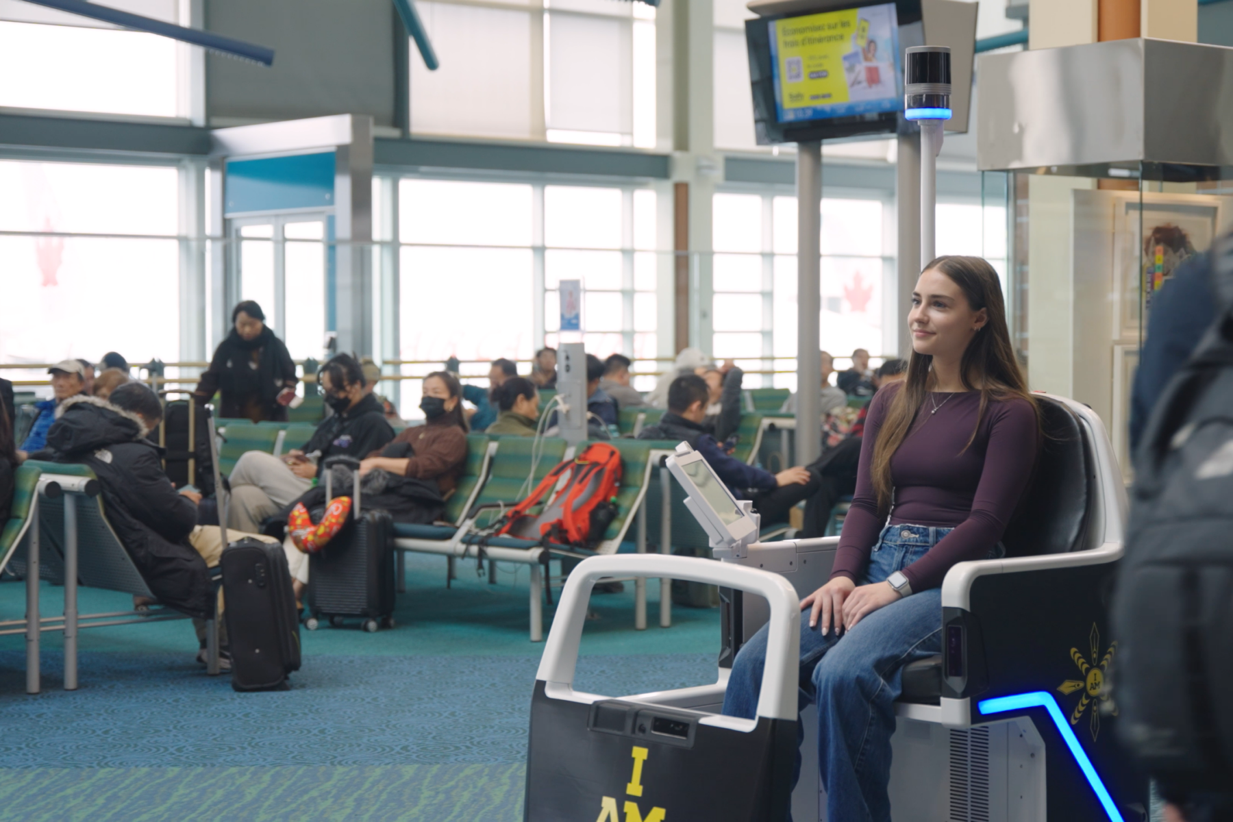 Female passenger on mobility pod at airport.